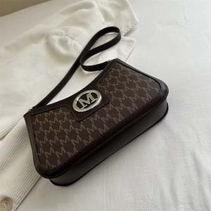 Retro baguette shoulder bag with brown leather trim and M-pattern monogram canvas