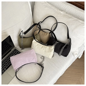 Pleated shoulder bags with silver chain straps in khaki, green, black, and white colors