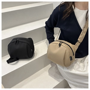 Minimalist nylon crossbody shell bags in black and beige with smooth double zippers