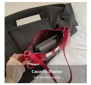 Interior view of the red and white bowling bag showing space for phone and wallet