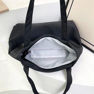 Black large capacity canvas tote bag with zipper and inner pocket for daily commuting