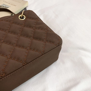 Quilted coffee brown crossbody bag with gold hardware and elegant retro texture