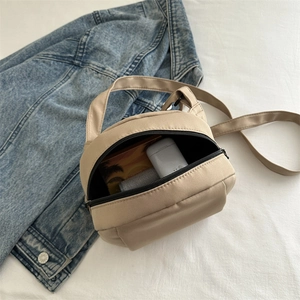 Beige lightweight nylon shell bag for women with top handle and crossbody strap