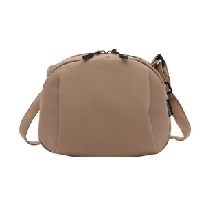 Minimalist khaki nylon shell bag with adjustable wide strap and double zipper closure