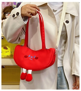 Cute red tomato cartoon canvas bag with 3D details shown on a model in daily wear