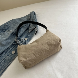 Elegant light brown rectangle underarm bag with silver chain strap and denim accent