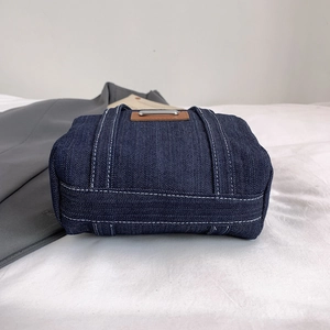 Classic dark blue denim crossbody handbag with contrast white stitching and metal buckle