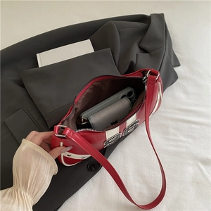 Retro red and white contrasting underarm bag with zipper closure and logo detail