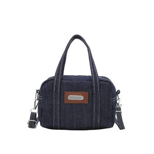 Mini washed denim handbag with contrast stitching and adjustable leather crossbody strap