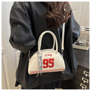 Detail of Los Angeles 95 print and silver tassel on white bowling handbag for women
