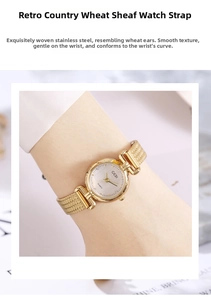 Detailed close-up of GEDI women's watch with golden wheat pattern stainless steel mesh band