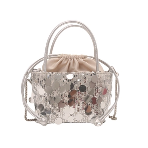 Chic silver sequin bucket bag with drawstring closure and elegant chain shoulder strap
