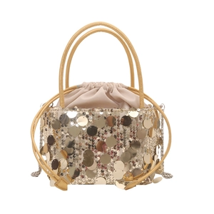 Sparkly gold sequin bucket bag with drawstring closure and metallic chain strap