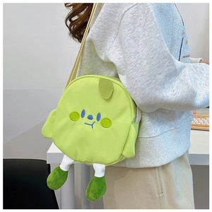 Detail of cute light green plush crossbody bag with cartoon face and 3D legs