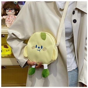 Detail showing the cute yellow cartoon crossbody bag with embroidery and soft limb decorations