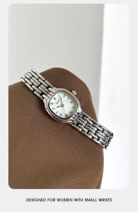 Detail of Gedi silver watch with mother of pearl dial and Roman numerals for small wrists