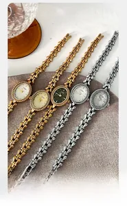 Multiple GEDI quartz watches with slim chain bracelets in gold and silver finishes