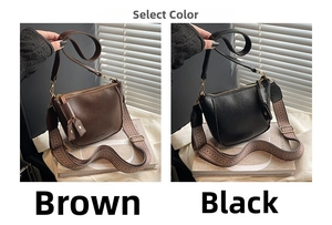 Detail of matte leather crossbody bags in brown and black with wide fabric straps