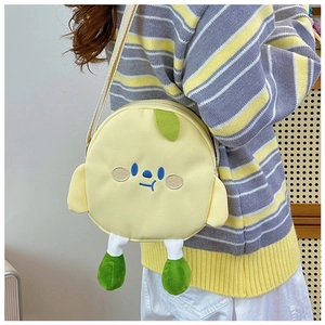 Detail of cute yellow cartoon plush crossbody bag with embroidery and green leaf decor