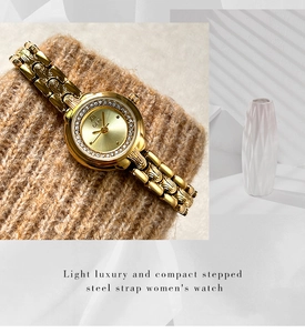 Detail of GEDI gold quartz watch with rhinestone bezel and vintage floral strap engraving