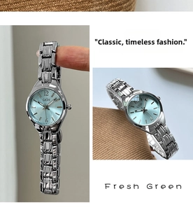 Close-up of GEDI women's watch featuring a fresh green sunray dial and silver metal chain