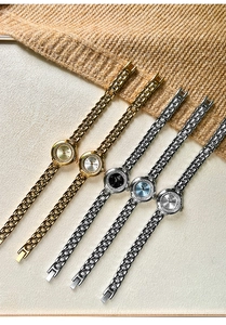 Detail view of stylish women's quartz watches with diamond bezels and metal chain bracelets