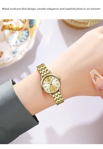 Close-up view of GEDI women's gold steel strap quartz watch with elegant sunray dial on wrist.