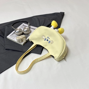 Cute yellow canvas crossbody bag with cartoon embroidery and soft horn details