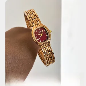 Macro shot of Gedi vintage square watch with deep red dial and golden chain strap