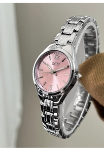 Close-up of GEDI women's watch with silver metal band and pink sunray dial