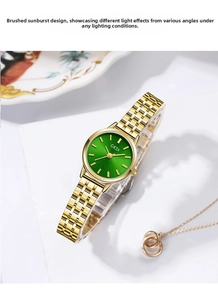 Detail shot of GEDI women's quartz watch with green sunburst dial and gold band.