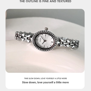 Macro detail of GEDI vintage quartz watch with silver oval case and crystal bezel