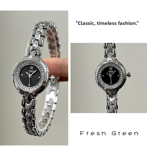Detail of silver steel bracelet watch with black dial and crystal bezel by GEDI
