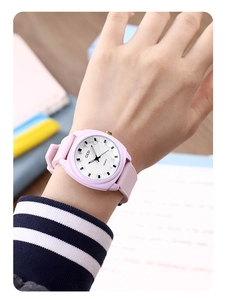 Wrist view of a light purple GEDI quartz watch with silicone strap and geometric dial