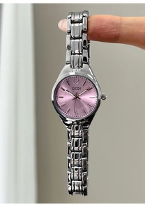 Detailed view of silver stainless steel watch with pink sunburst dial and GEDI branding