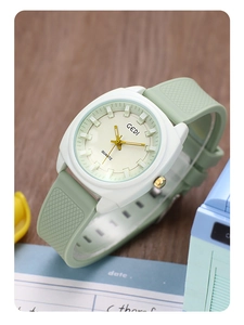Detail of mint green silicone strap and white resin case with GEDI quartz movement
