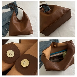 Detail view of large brown PU leather tote bag with magnetic clasp and spacious interior