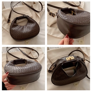 Macro view of dark brown woven crescent bag showing texture, strap and metal buckle detail