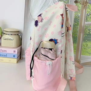 Cute large capacity cartoon backpack for students with pink dog prints and side pockets