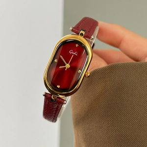 Gedi vintage oval watch for women with red dial and gold case on a red leather strap