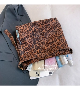 Detail of leopard print tote bag showing large capacity for wallet, phone and cosmetics