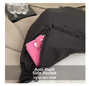 Detail showing anti-theft side zipper pocket on a black nylon crossbody dumpling bag