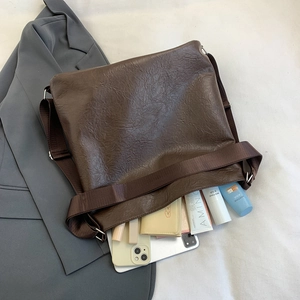 Brown large tote bag with pleated texture and wide strap for autumn commute styles