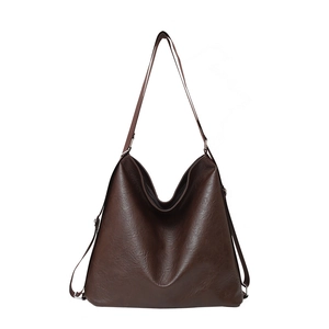 Large dark brown leather tote bag with vintage texture and adjustable shoulder straps
