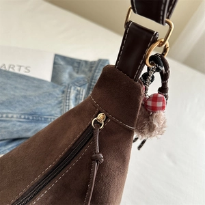Retro brown suede tote bag for women with decorative plush charm and white stitching