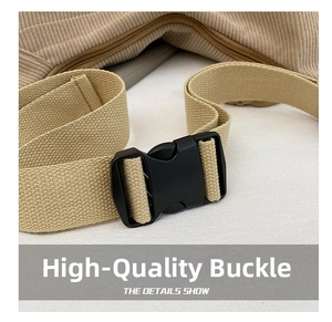 Detail of durable black plastic buckle and beige corduroy fabric on a shoulder bag