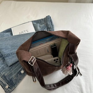 Retro canvas tote bag with brown leather straps and large interior capacity shown from top