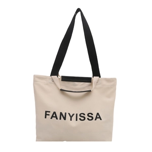 Minimalist beige canvas tote bag with black handles and FANYISSA letter print