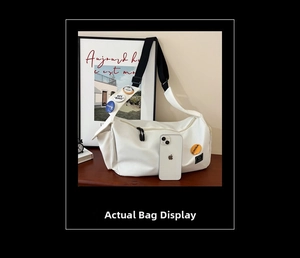 Large white nylon messenger bag with colorful badges and spacious interior detail