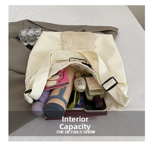 Internal capacity of white corduroy tote bag showing space for daily essentials